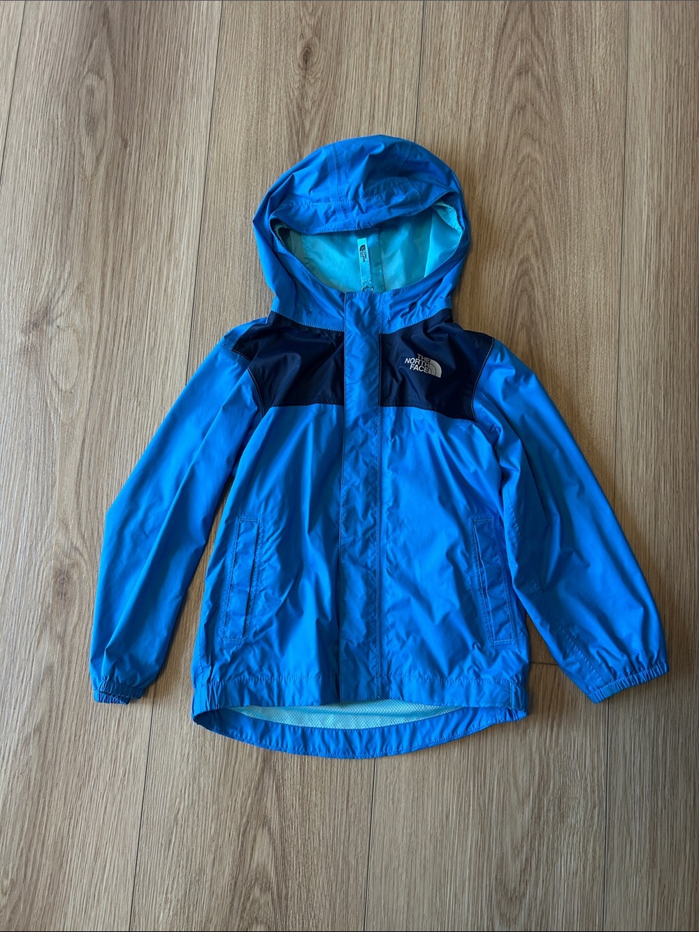 The North Face Bright Blue Kids' Hooded Rain Jacket with Navy Accents